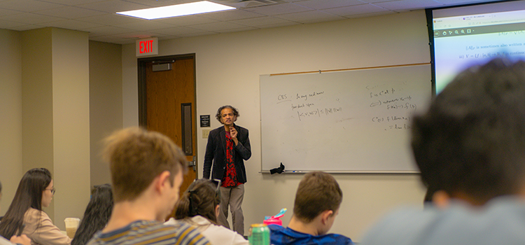 Mathematical Sciences Professor Viswanath Ramakrishna teaches a classroom full students in the Science Learning Center on the UT Dallas campus.